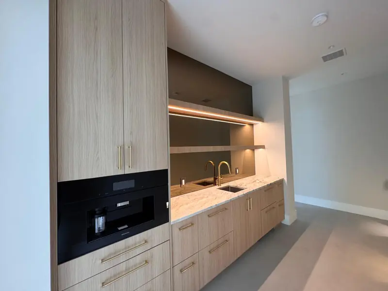 White oak coffee bar with built-in espresso machine and sink by Eco Woodwork & Design