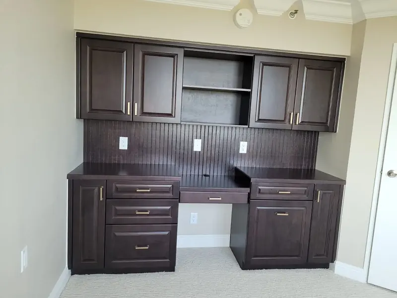 Dark wood office desk with hutch cabinetry