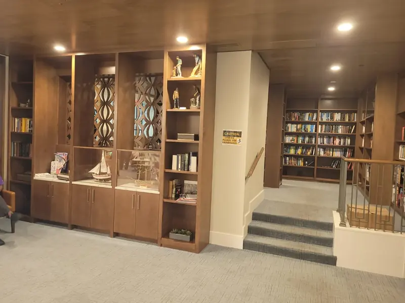 Built-in wood display cabinetry and library shelving crafted by Eco Woodwork & Design