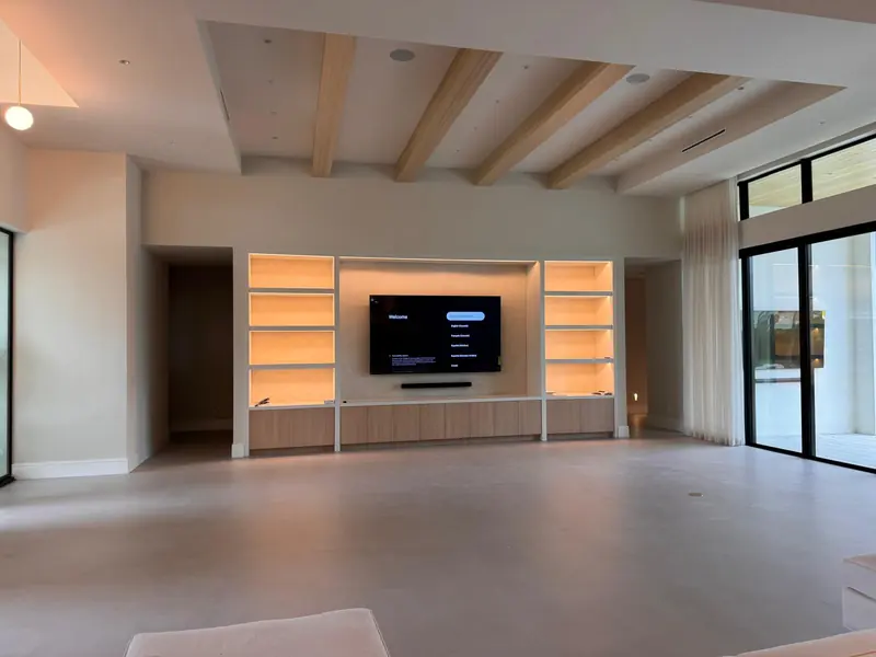 White oak media wall with backlit display shelves by Eco Woodwork & Design